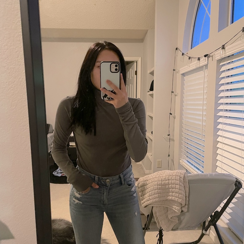 Grey turtleneck bodysuit.